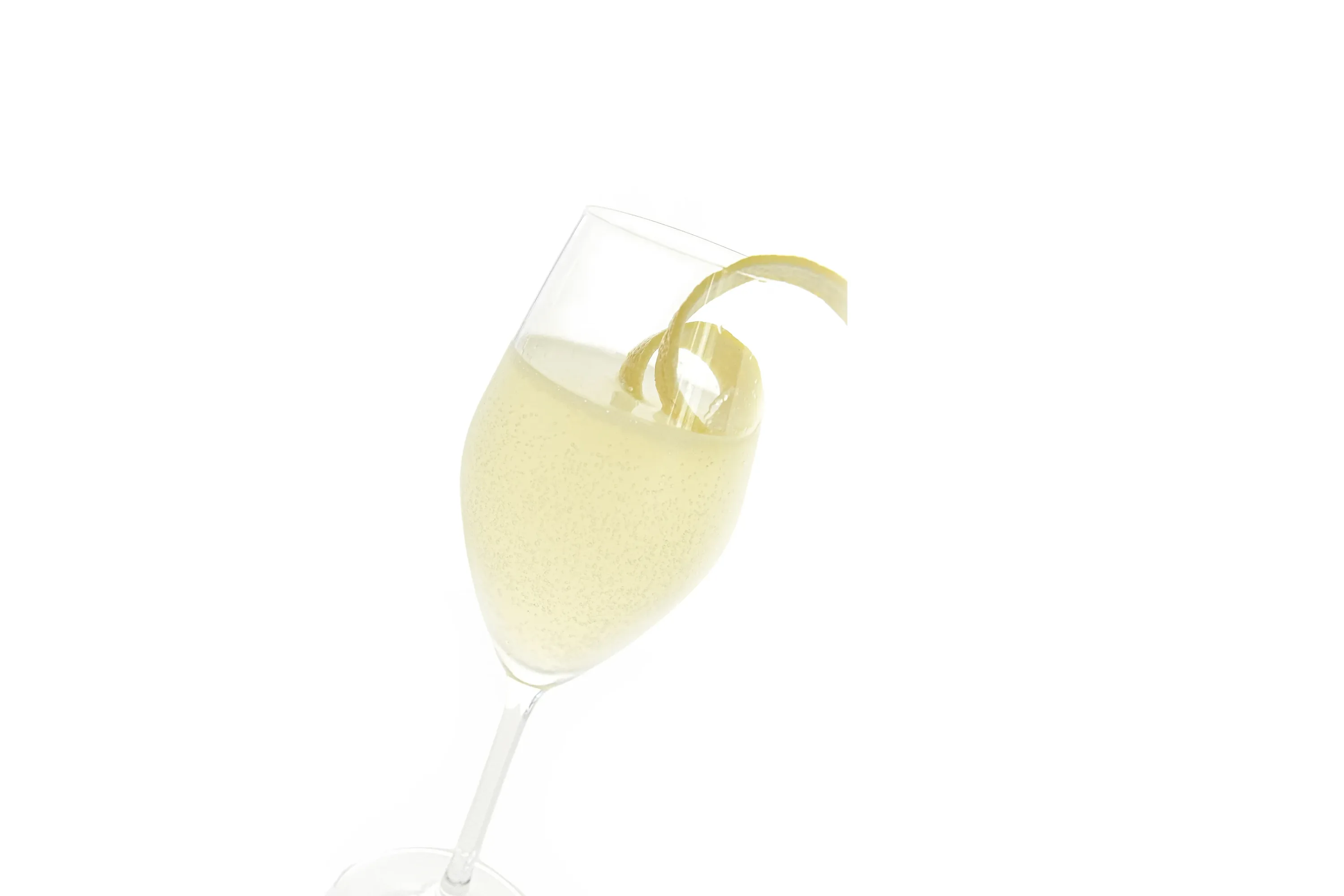 French 75 sparkling in a Champagne glass with a lemon spiral