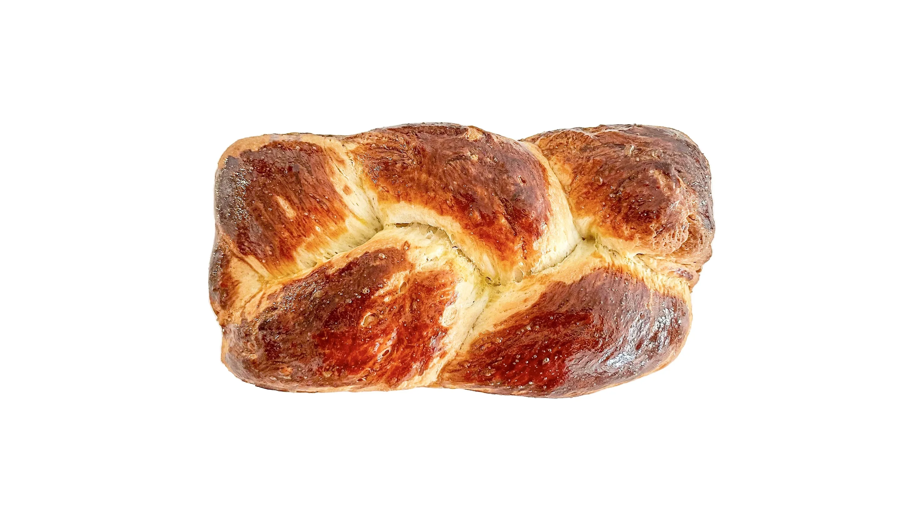 A freshly baked braided French brioche loaf