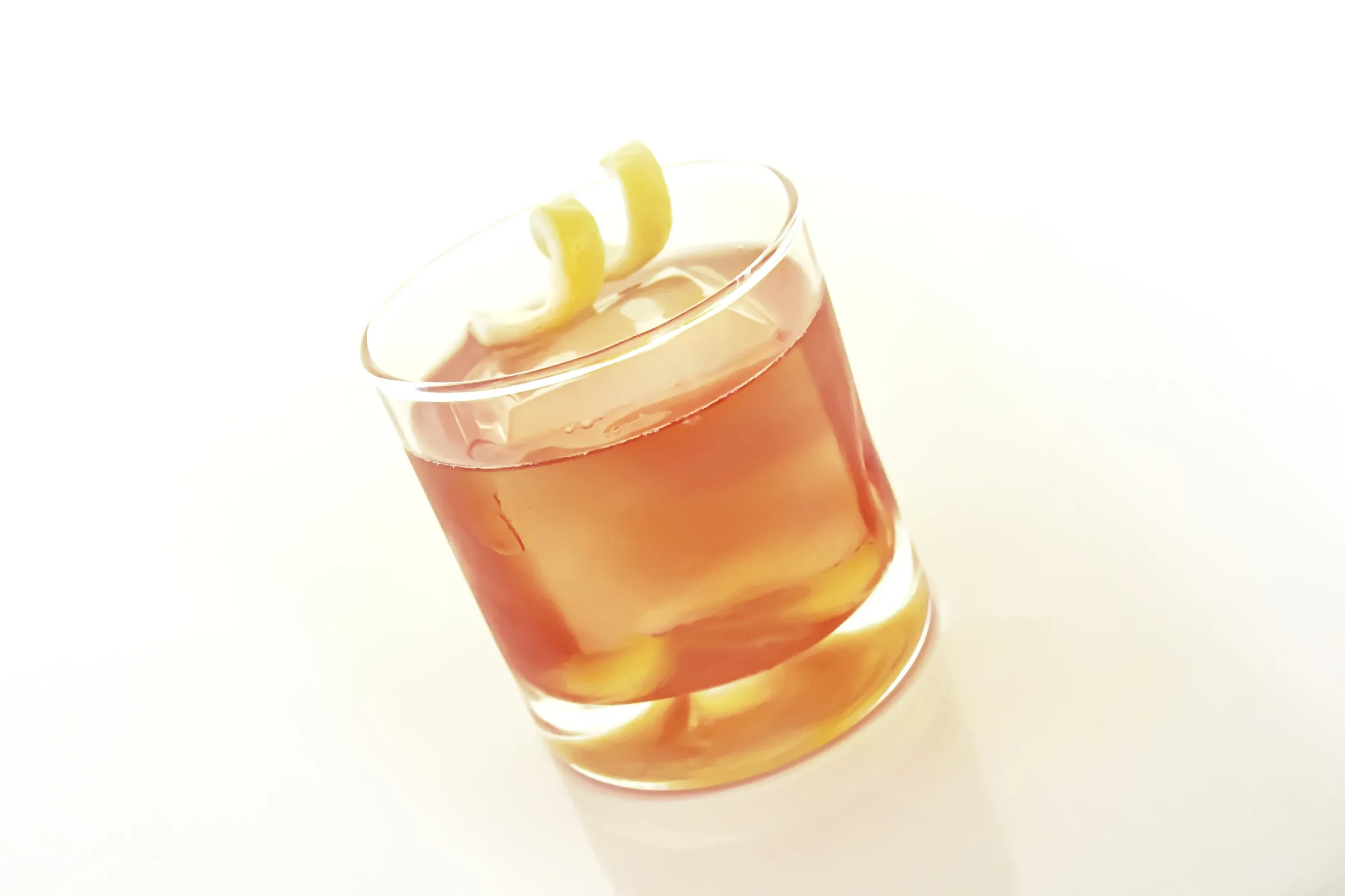 Negroni served over a large clear ice cube