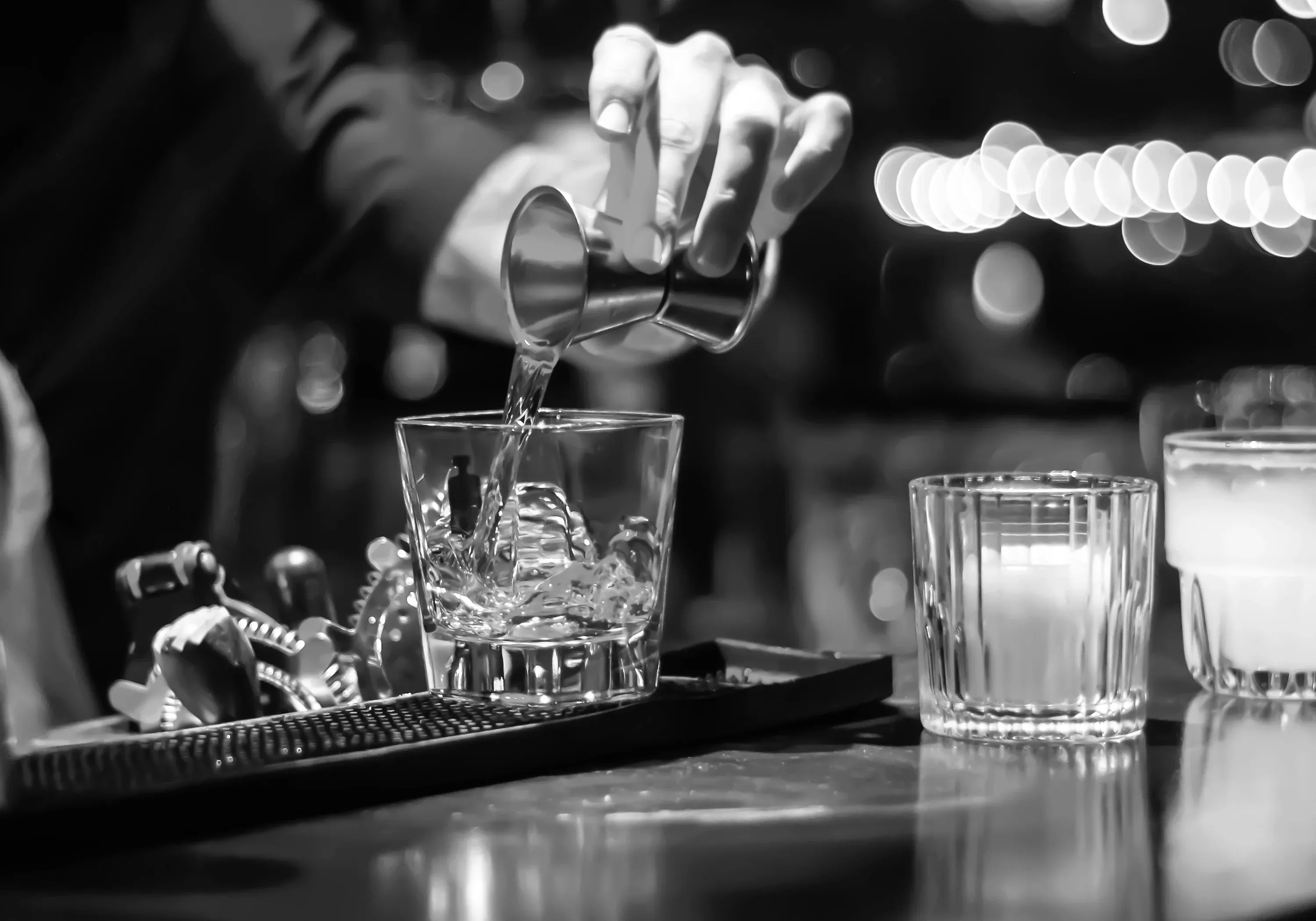 A bartender crafting a cocktail