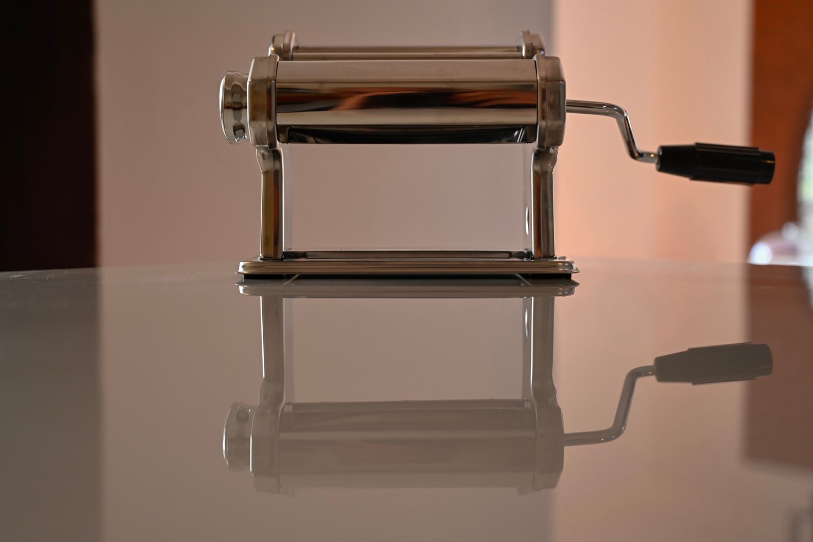 Manual pasta machine reflected on the kitchen counter at Hacienda Eterna Primavera